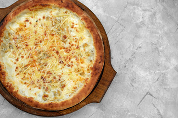 Closeup view of four cheese pizza isolated over white.