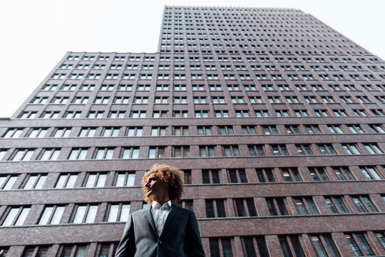 Thoughtful businessman standing at Potsdamer Platz