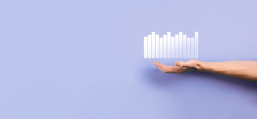 Male hand holding smart mobile phone with graph icon.checking analyzing sales data growth graph chart and stock market on global networking. Business strategy, planning and digital marketing