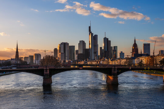 Germany, Hesse, Frankfurt, Ignatz Bubis Bridge at dusk with downtown skyline in background