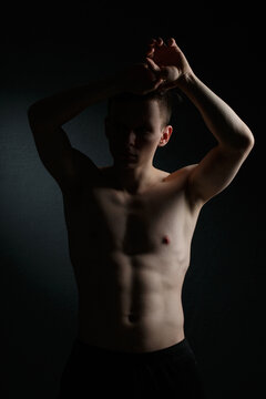 Athletic guy on a black background.