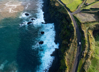 Portugal, Azores, Ribeira Grande, Drone view of dirt road stretching along edge of Sao Miguel Island