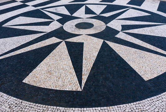 Compass rose painted on paved terrace