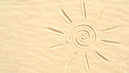 Fototapeta na wymiar The sun is drawn on the sand with a finger from a copy space