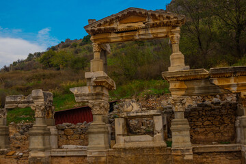 Naklejka premium EPHESUS, TURKEY: On Kuretov Street, the Fountain of Troyan and the ruins of the ancient city of Ephesus.