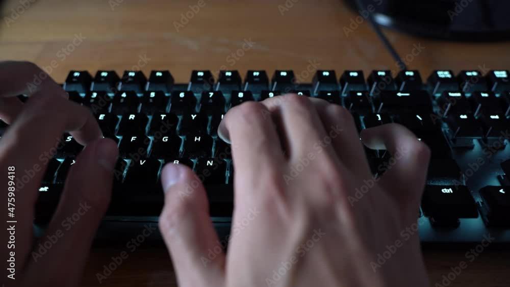 Sticker a closeup of male hands typing on a black keyboard