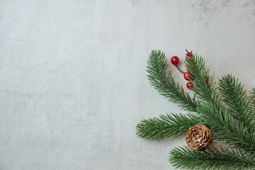 christmas concrete background with fir twigs and sequins , the concept of Christmas and Christmas sales