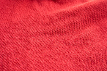 closeup red knitted woolen fabric texture background