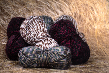 Close Up of yarn balls. Rainbow colors. Yarn for knitting. Skeins of yarn. Knitting needles, colorful threads. Knitting background, Knitting yarn for handmade winter clothes.