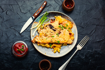 Baked meat with potatoes and cheese.