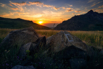 Beautiful sunset scene in Macin mountains in Romania
