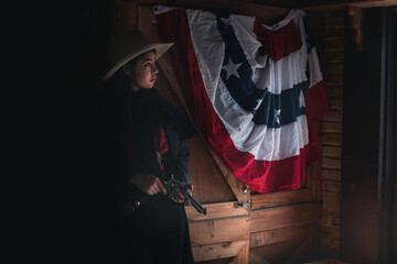 Cowboy posing with rifle gun on hand to show protected weapon ,vintage style.