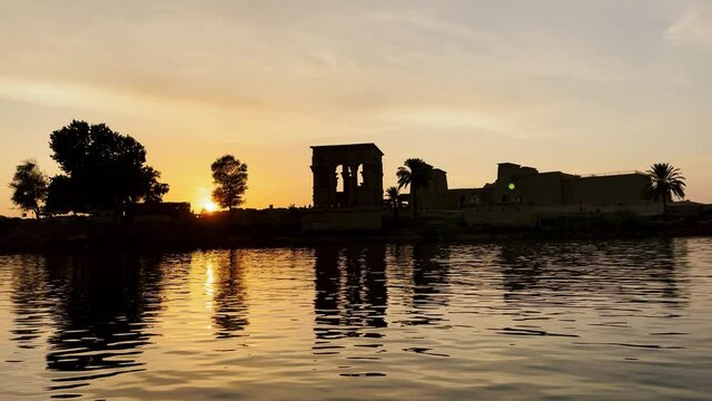 Beautiful Isis Philae temple at sunset light the beautiful temple of Philae and the Greco-Roman buildings are seen from the Nile river a temple dedicated to Isis, goddess of love Aswan Egyptian