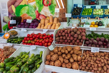 fruits and vegetables at the market on a tropical island; banana, sweet potato, tomatoes