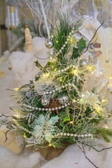 Small christmas tree with fancy decorations