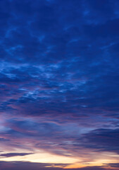 Beautiful view of sky with clouds at sunrise. Partly cloudy. Colorful sunset. Natural blue sky background texture, beautiful color.
