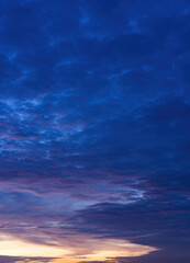 Beautiful view of sky with clouds at sunrise. Partly cloudy. Colorful sunset. Natural blue sky background texture, beautiful color.