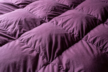 purple quilted texture with diagonal lines. contrast. selective focus. elegant design for graphic resources.