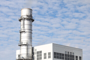 Industrial view of building and chimney.