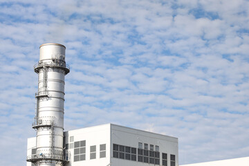 Industrial view of building and chimney.