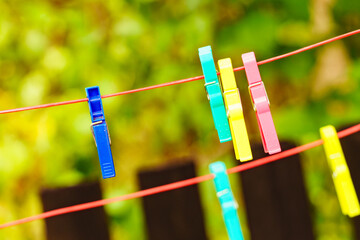 Clothes pegs on line outdoor. Housework