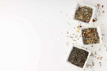 Concept of cooking tea with different types of tea on white background