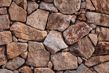 Fototapeta premium Stone wall. Outdoor background natural stone.