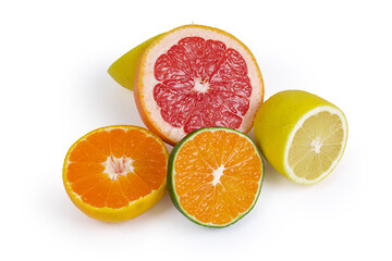 Halves of some various citrus on a white background