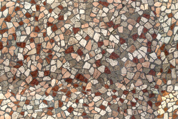 Detail of a mosaic pavement typical of Italian pedestrian streets. It's tiled so ideal for patterns and textures