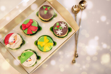 Christmas cupcakes, New Year's dessert. Santa claus cupcakes, snowman cupcakes. Dessert for new year and christmas