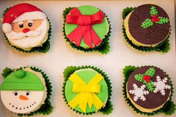 Christmas cupcakes, New Year's dessert. Santa claus cupcakes, snowman cupcakes. Dessert for new year and christmas