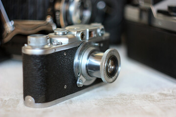 Fototapeta na wymiar Vintage rangefinder and SLR film cameras
