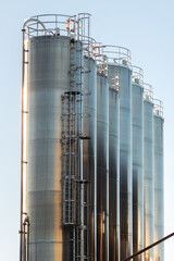 Stainless steel silos on a sunny autumn morning