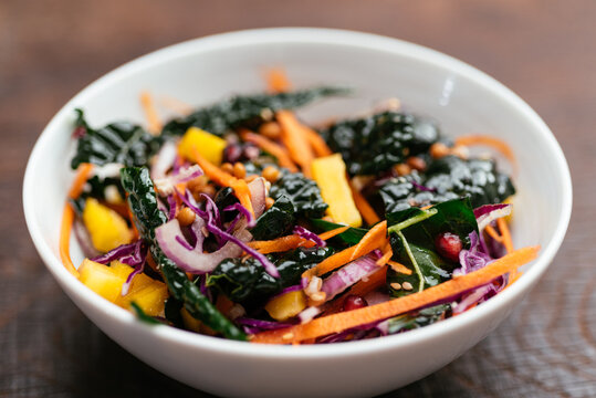 Home made salad with lentils, kale, carrots, red cabbage, onion and pomegranate arils.