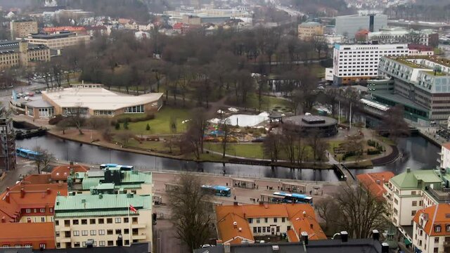 Public bus stop on downtown of majestic town Bor&aring;s with colorful buildings, aerial drone view