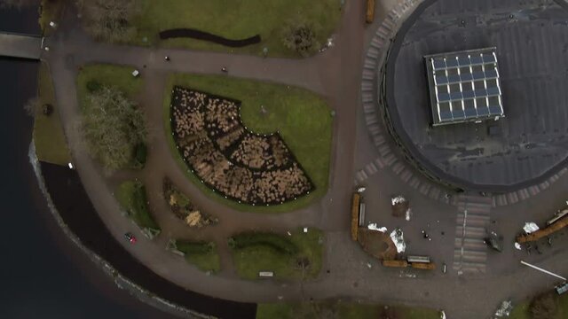 Downtown of Bor&aring;s town with green park and kids playground, aerial top down view on moody day