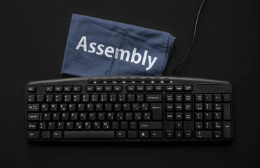 Assembly programming language. Rag width word Assembly and computer keyboard.
