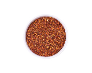 Dry rooibos tea in white bowl isolated on white background. Healthy drink.