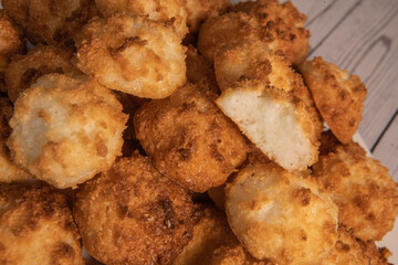 Rocher coco from coconut dessert in brown color make with white eggs and sugar