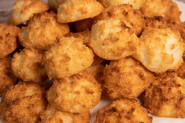 Rocher coco from coconut dessert in brown color make with white eggs and sugar