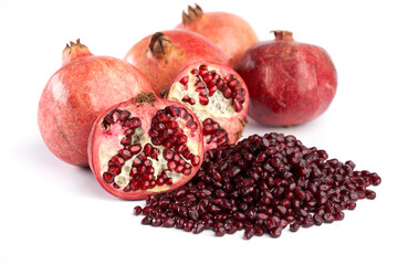 Pomegranate fruits and seeds on whit ebackground