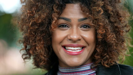 happy black African woman with curly hair nodding yes agreeing