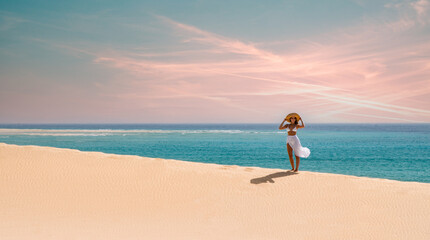 Fototapeta na wymiar Woman in beachwear standing on beach