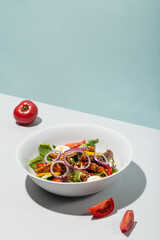 Salad with grilled eel and vegetables tomatoes onion eggs hard shadows modern