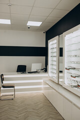 Optic shop with spectacles on shelves