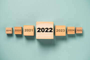 2022 year on the biggest wooden cube among others year for focus and start new business for new...