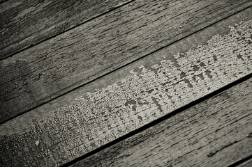 Black and white image of rusty wood board