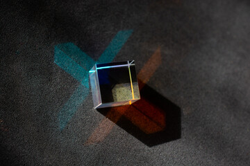 Optical glass cubes scatter spectrum light with all the colors of the rainbow on the surface