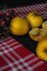 Front view of yellow apples on black background
