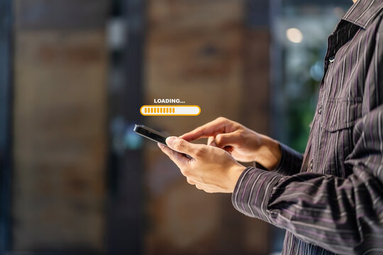 Hand man using mobile smartphone for download application and waiting to loading. Loading icon on screen. businessman downloading digital business data form website and cloud to smartphone